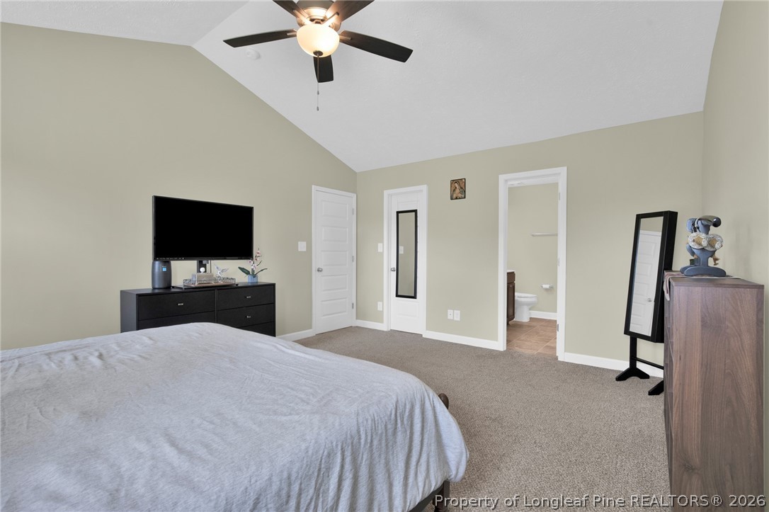 351 Sandy Grove Road Parkton, NC 28371 - Photo 20 of 30 a bedroom with a bed and a flat tv screen on dresser