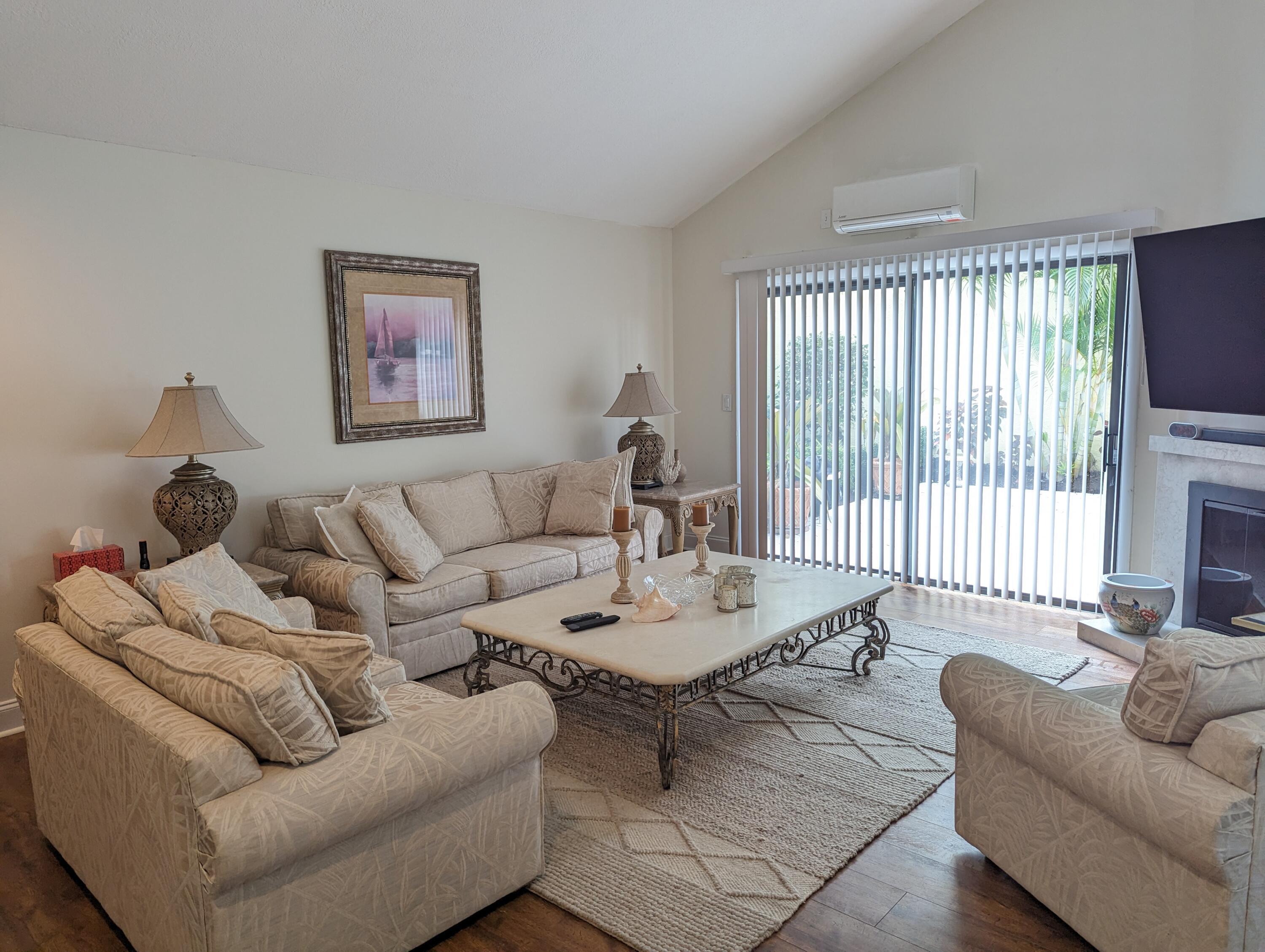 17042 Traverse Circle Jupiter, FL 33477 - Photo 3 of 30 a living room with furniture and a window