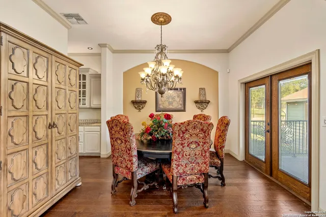 a large white kitchen with a large window