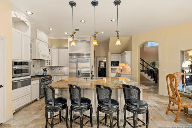 a dining room with furniture and window