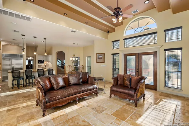 a view of a kitchen area with furniture and wooden floor