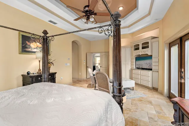 a spacious bathroom with a tub sink and mirror