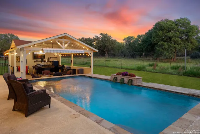 a balcony with furniture and a fireplace