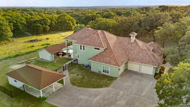 an aerial view of residential houses with outdoor space
