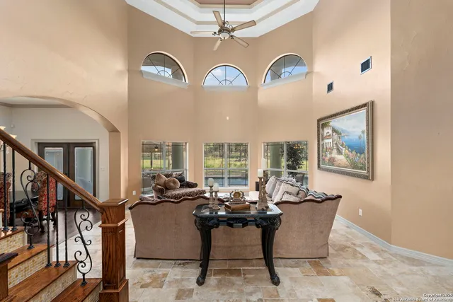 a view of a livingroom with furniture and entryway
