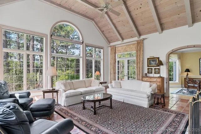 a kitchen with a refrigerator sink and cabinets