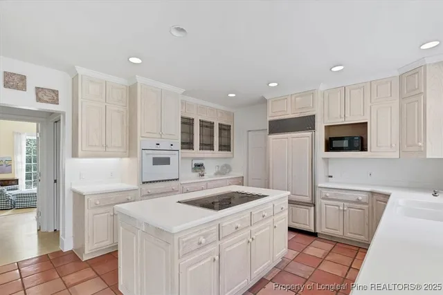 a bathroom with a bathtub and a window