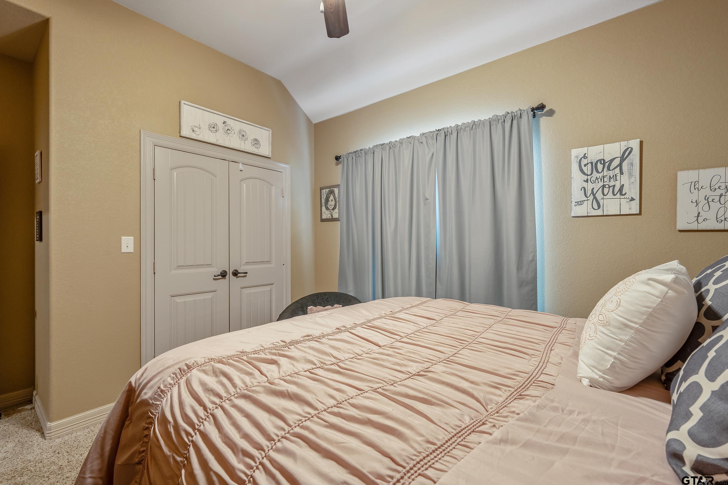 140 Creek Drive Marshall, TX 75672 - Photo 13 of 35 a bedroom with a bed and a window