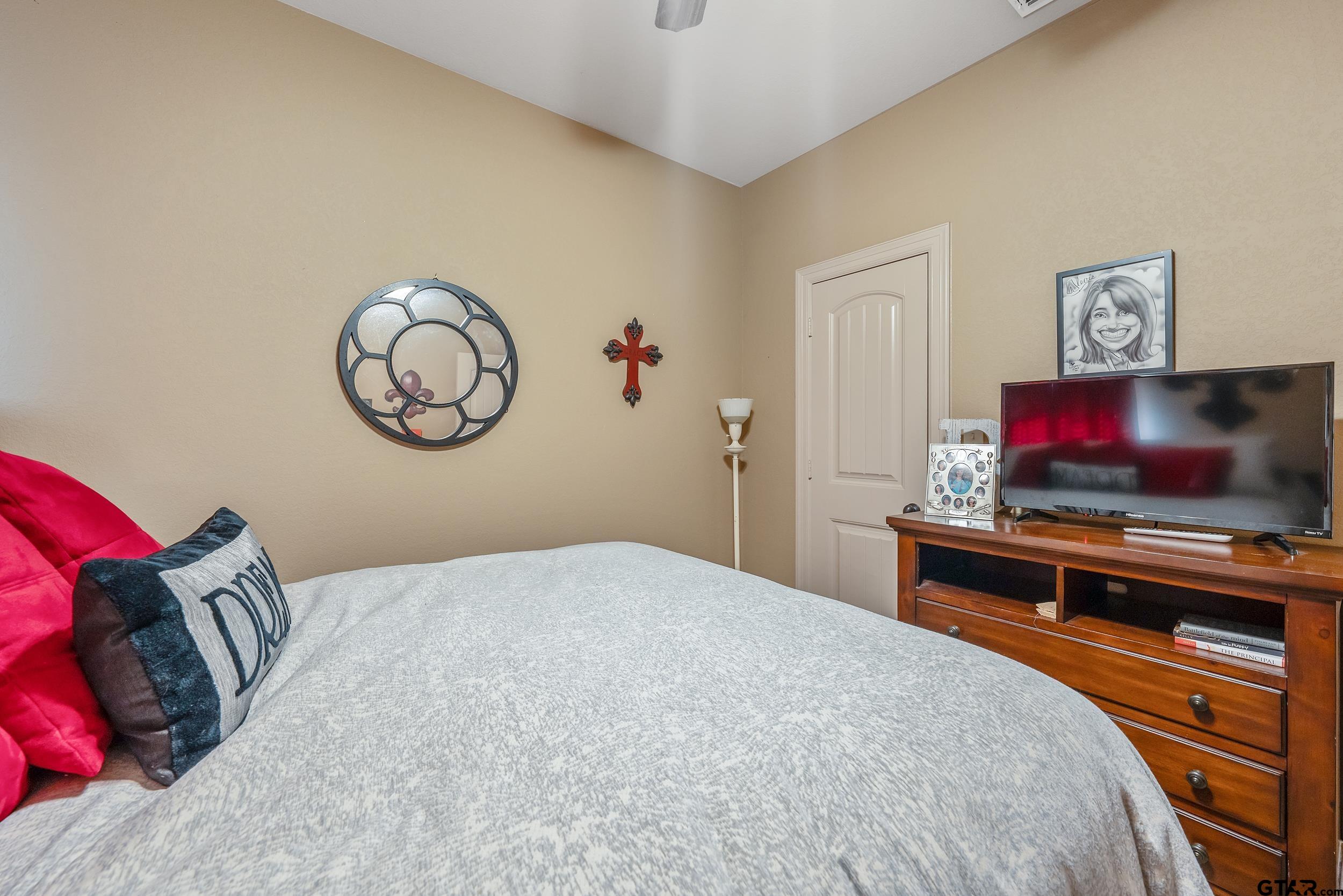 140 Creek Drive Marshall, TX 75672 - Photo 15 of 35 a bedroom with a bed and a flat screen tv