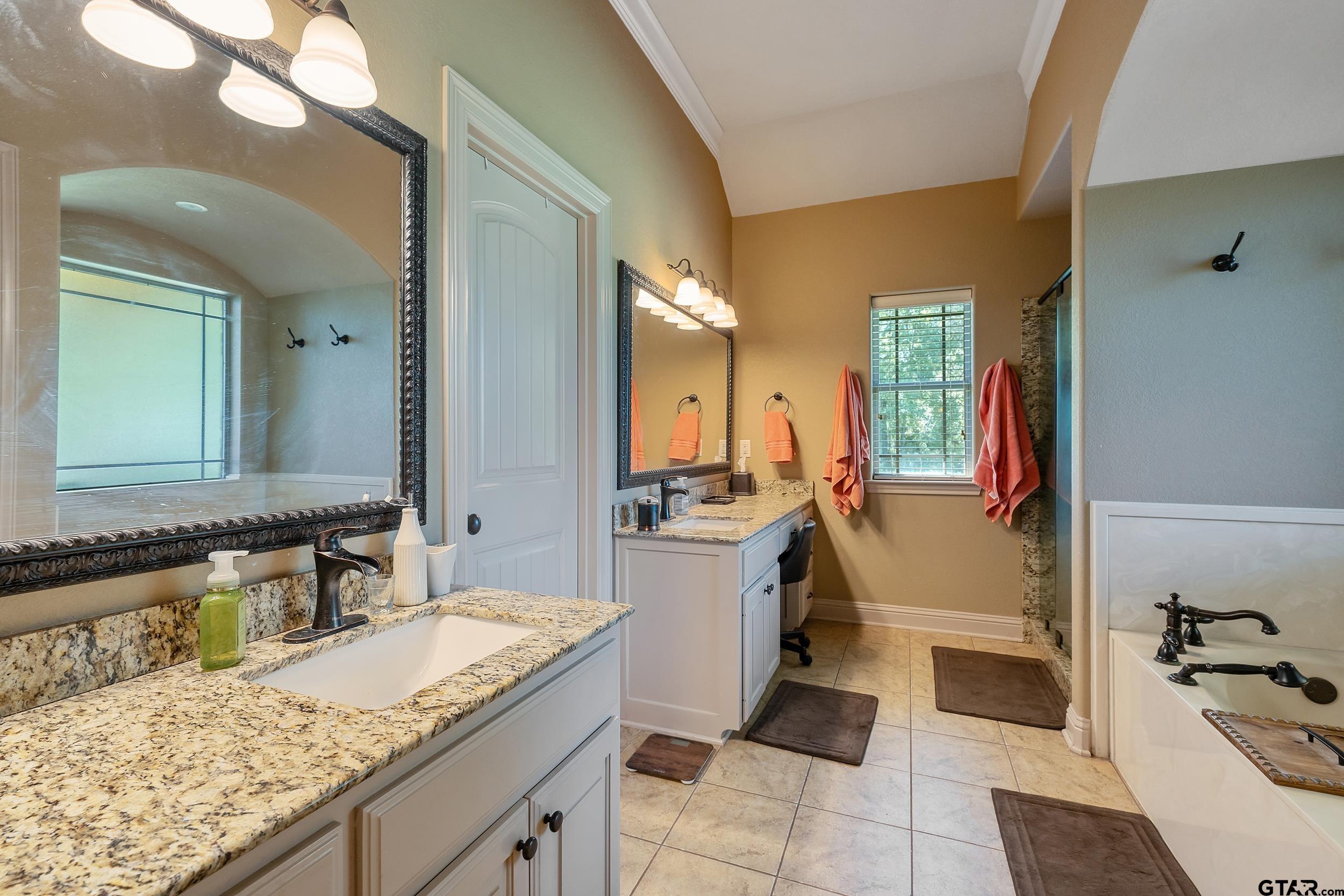140 Creek Drive Marshall, TX 75672 - Photo 19 of 35 a bathroom with a granite countertop sink and a mirror