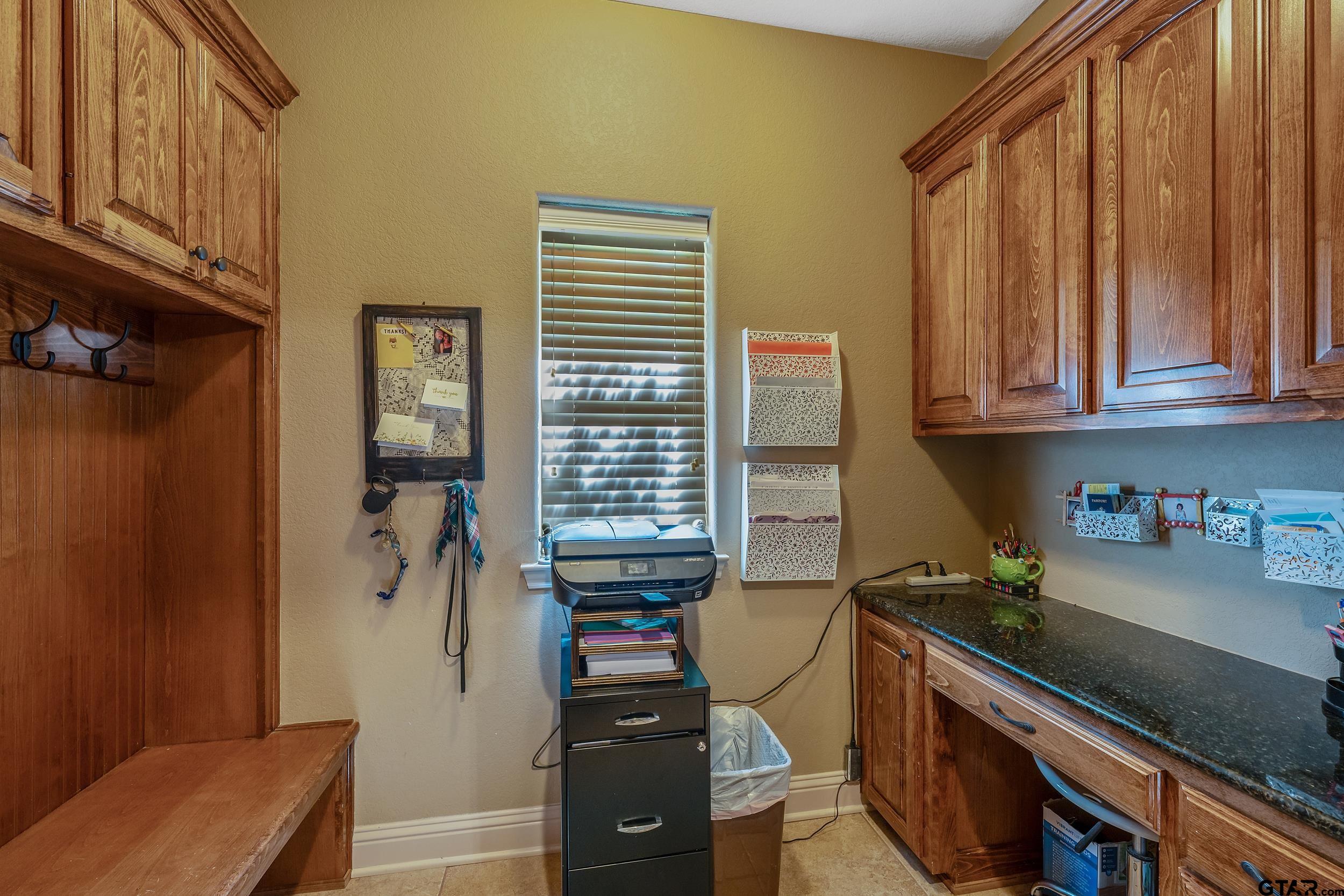 140 Creek Drive Marshall, TX 75672 - Photo 22 of 35 a kitchen with a refrigerator and a stove top oven