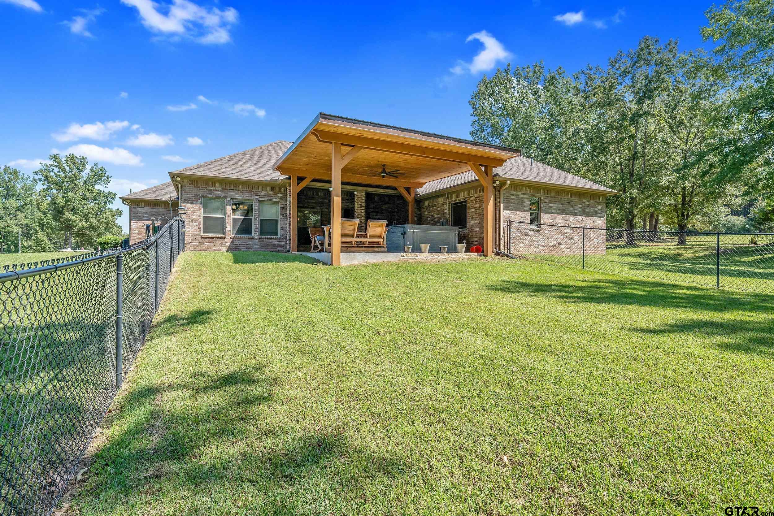 140 Creek Drive Marshall, TX 75672 - Photo 27 of 35 a view of a house with a yard