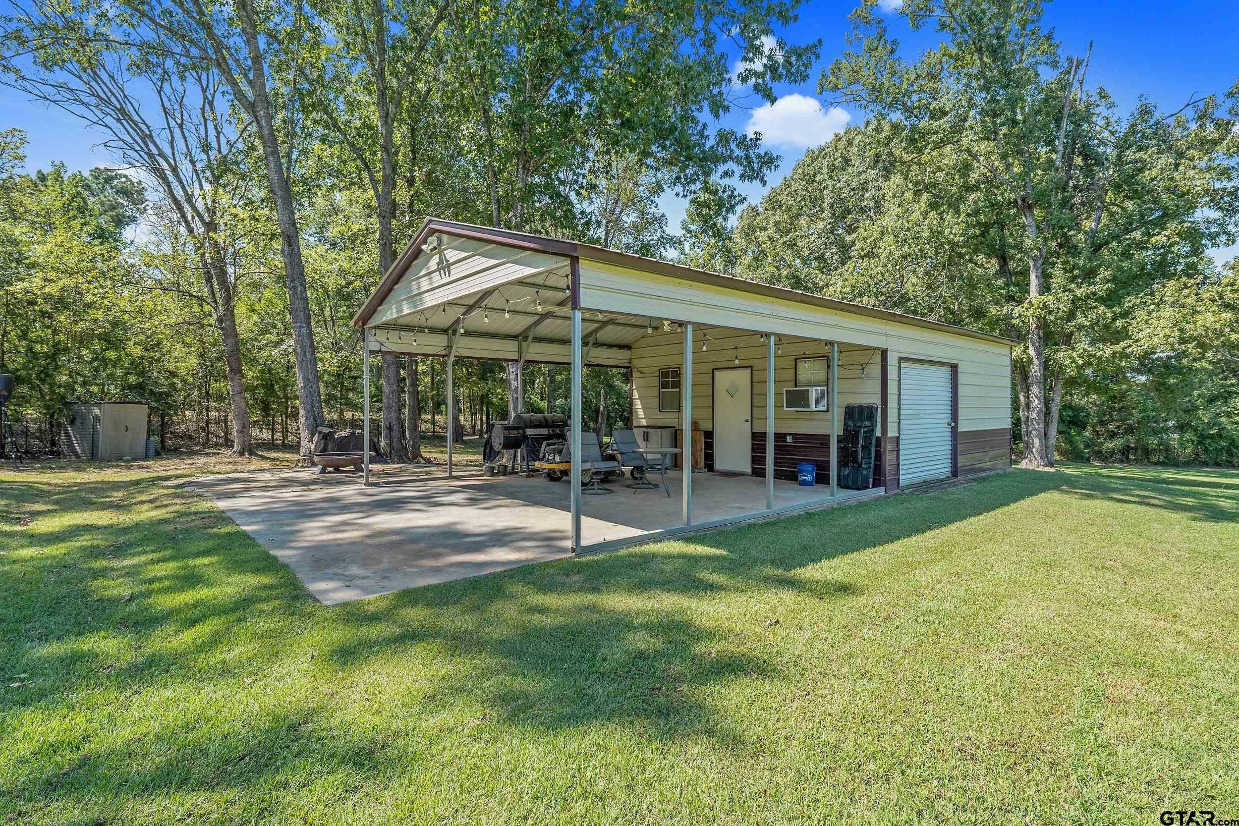 140 Creek Drive Marshall, TX 75672 - Photo 28 of 35 a view of a house with a yard and sitting area
