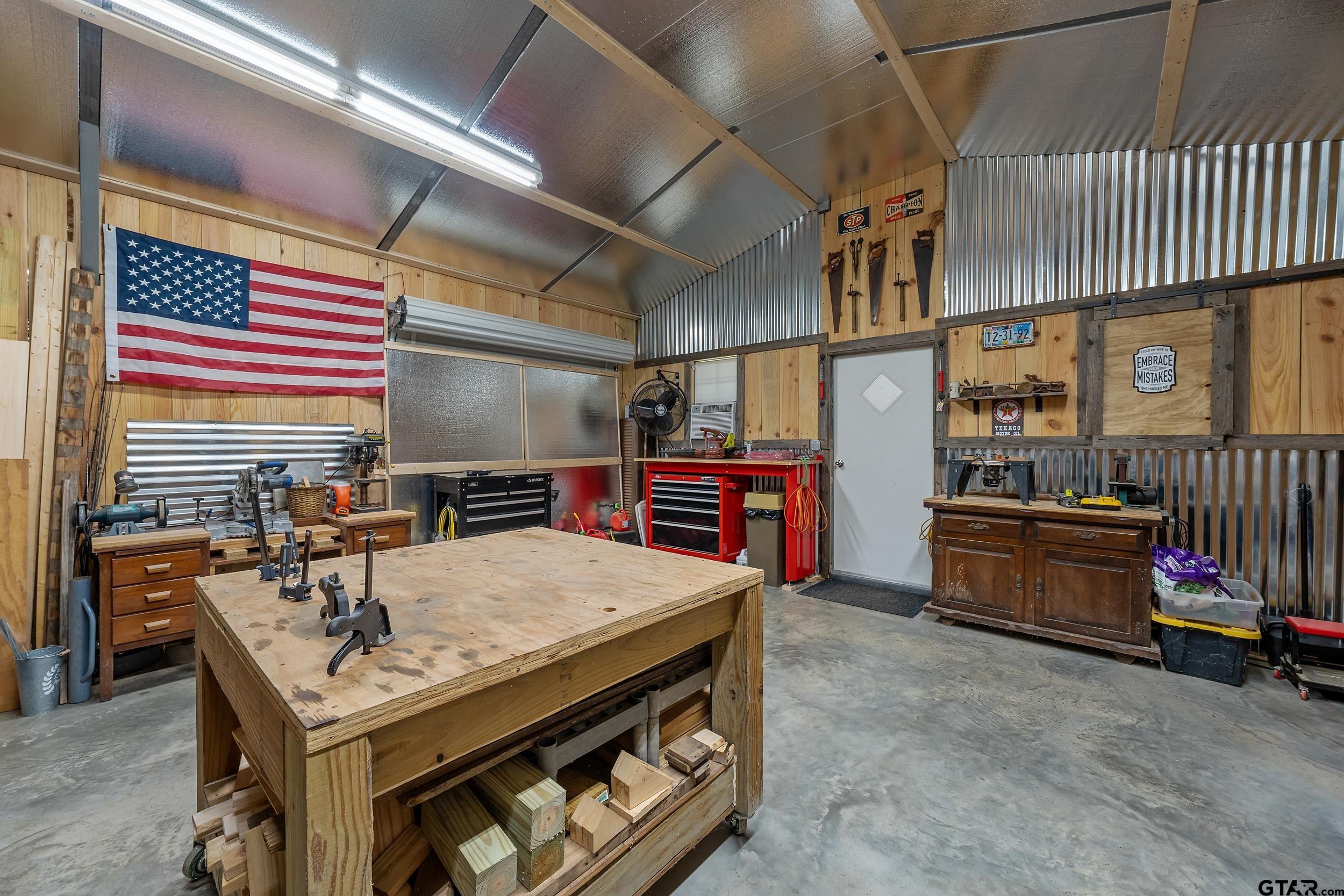 140 Creek Drive Marshall, TX 75672 - Photo 31 of 35 a utility room with stainless steel appliances lots of wooden furniture