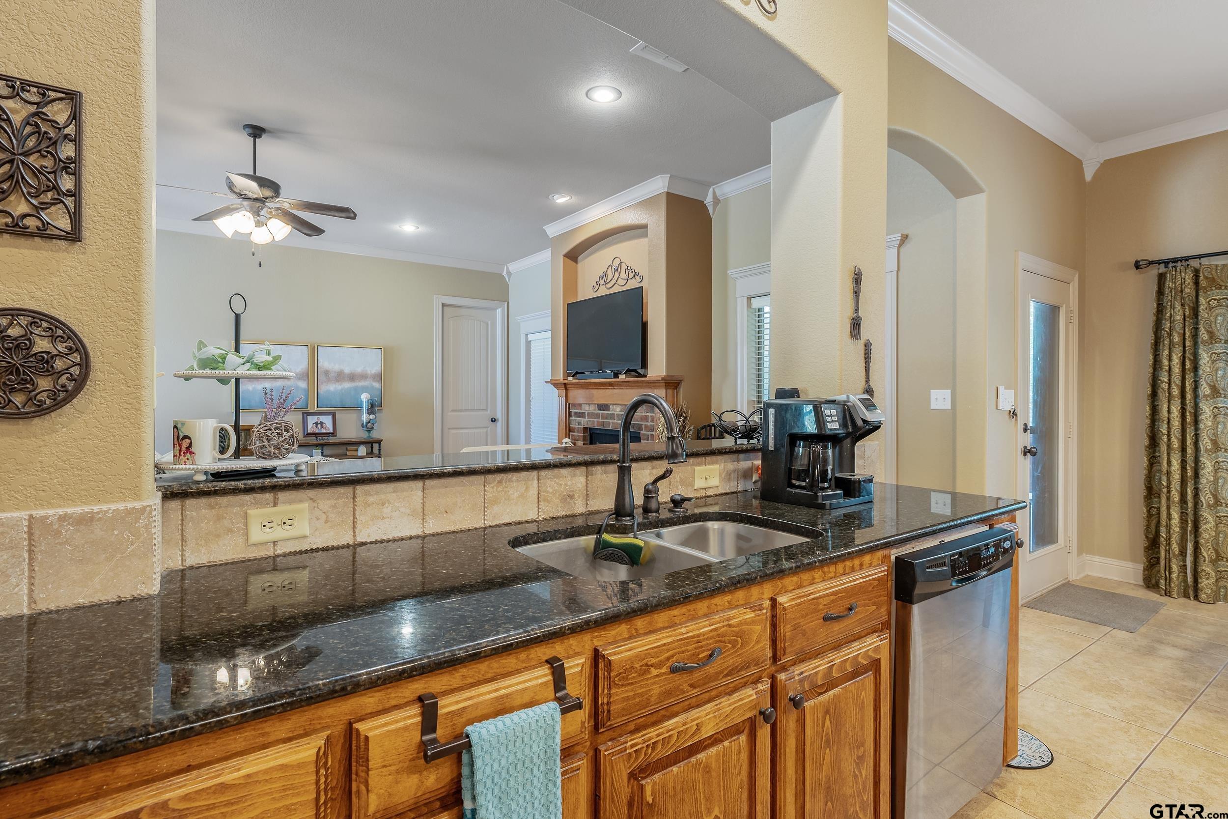 140 Creek Drive Marshall, TX 75672 - Photo 8 of 35 a kitchen with kitchen island granite countertop a sink and stainless steel appliances