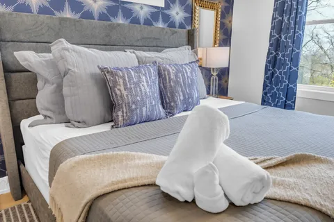 a bathroom with a double vanity sink mirror and shower