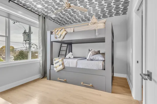a bedroom with a bed and a window