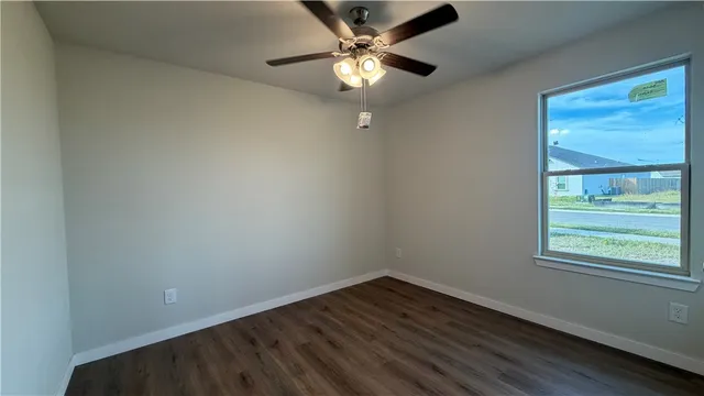 a view of a kitchen with a dishwasher and wooden floor