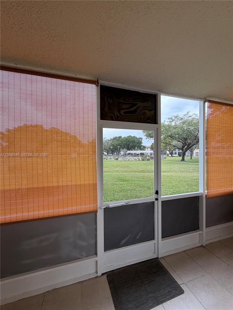 200 Southwest 132nd Way, Unit 109L Pembroke Pines, FL 33027 - Photo 11 of 18 a view of a room with an outdoor space