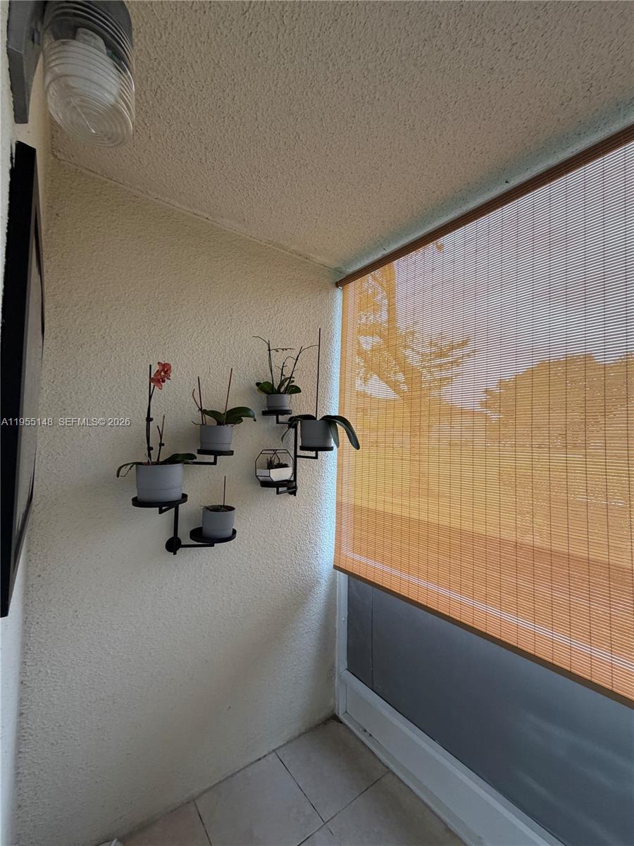 200 Southwest 132nd Way, Unit 109L Pembroke Pines, FL 33027 - Photo 10 of 18 a room with a table and chairs