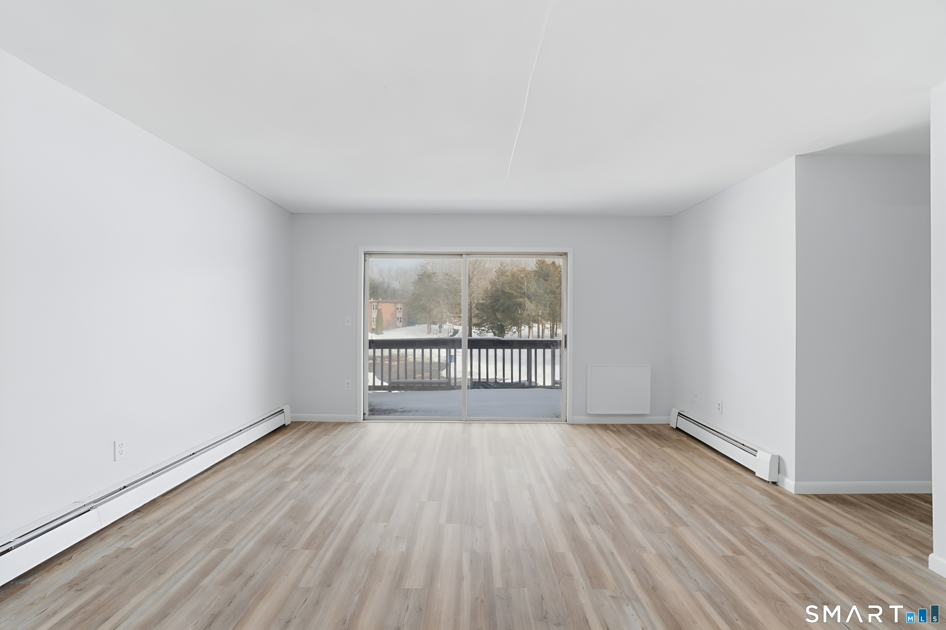 75 Balance Rock Road, Unit 20 Seymour, CT 06483 - Photo 17 of 80 an empty room with wooden floor and windows