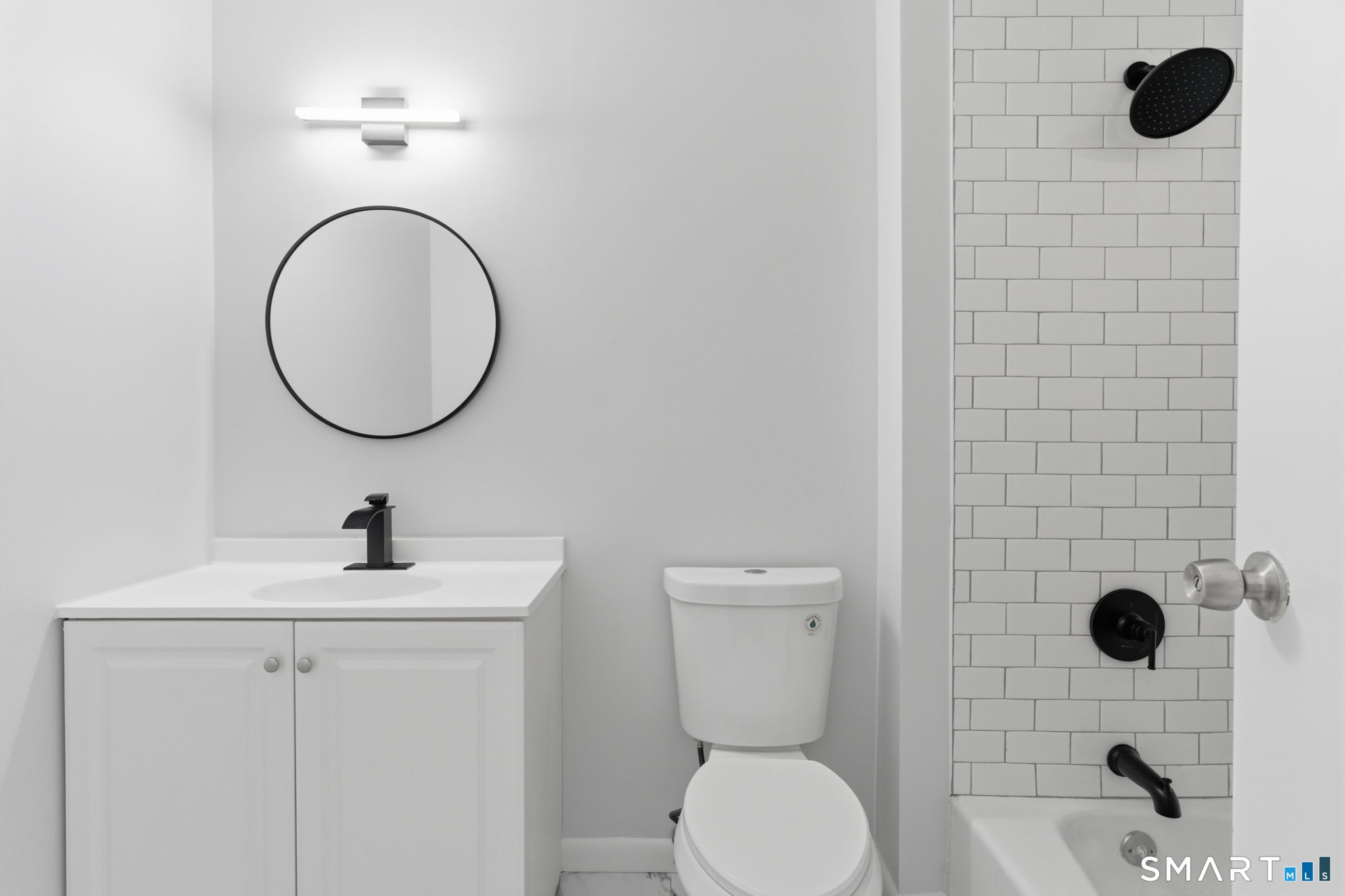 75 Balance Rock Road, Unit 20 Seymour, CT 06483 - Photo 22 of 80 a bathroom with a toilet sink and mirror