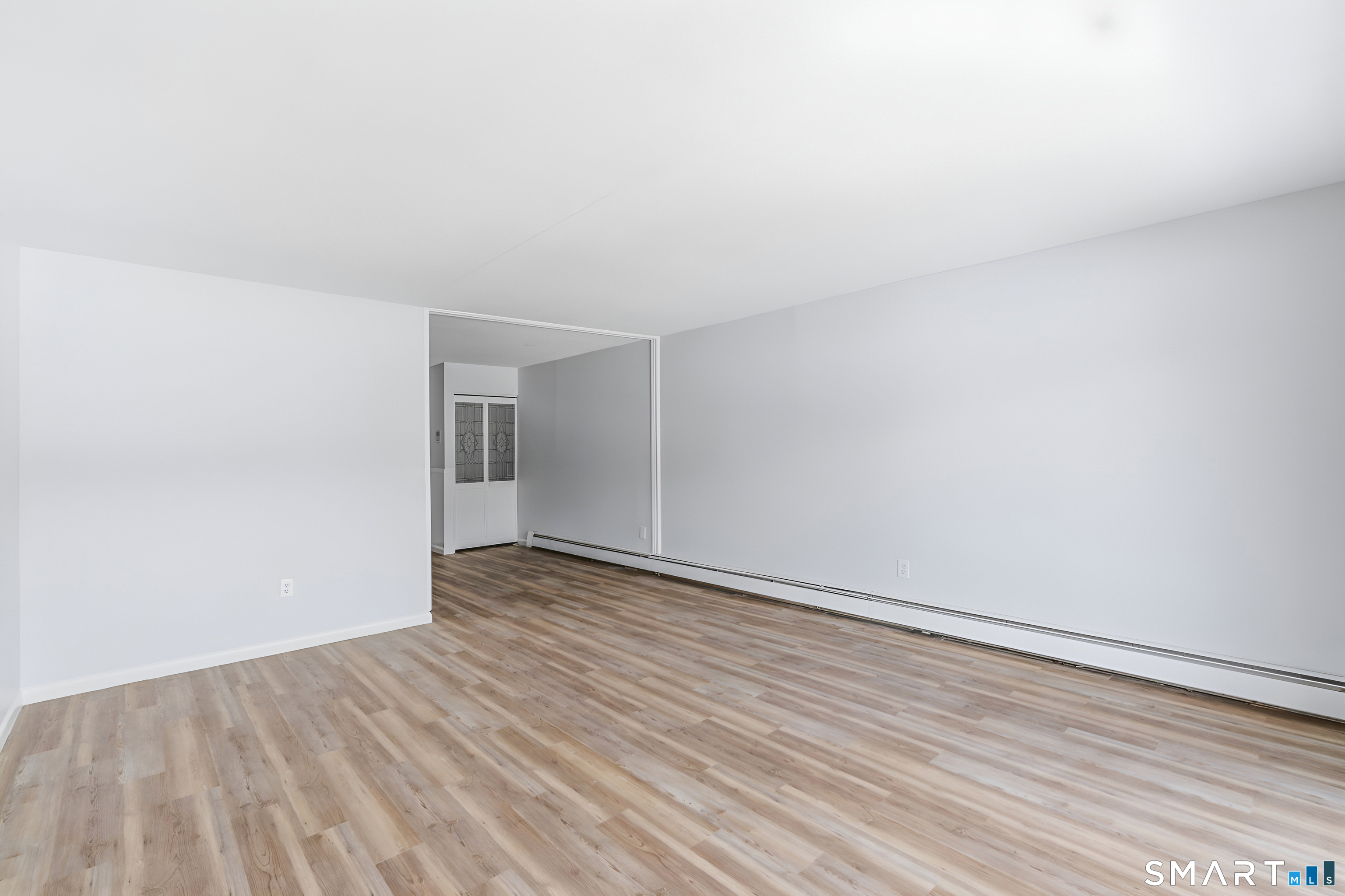75 Balance Rock Road, Unit 20 Seymour, CT 06483 - Photo 28 of 80 a view of an empty room with wooden floor