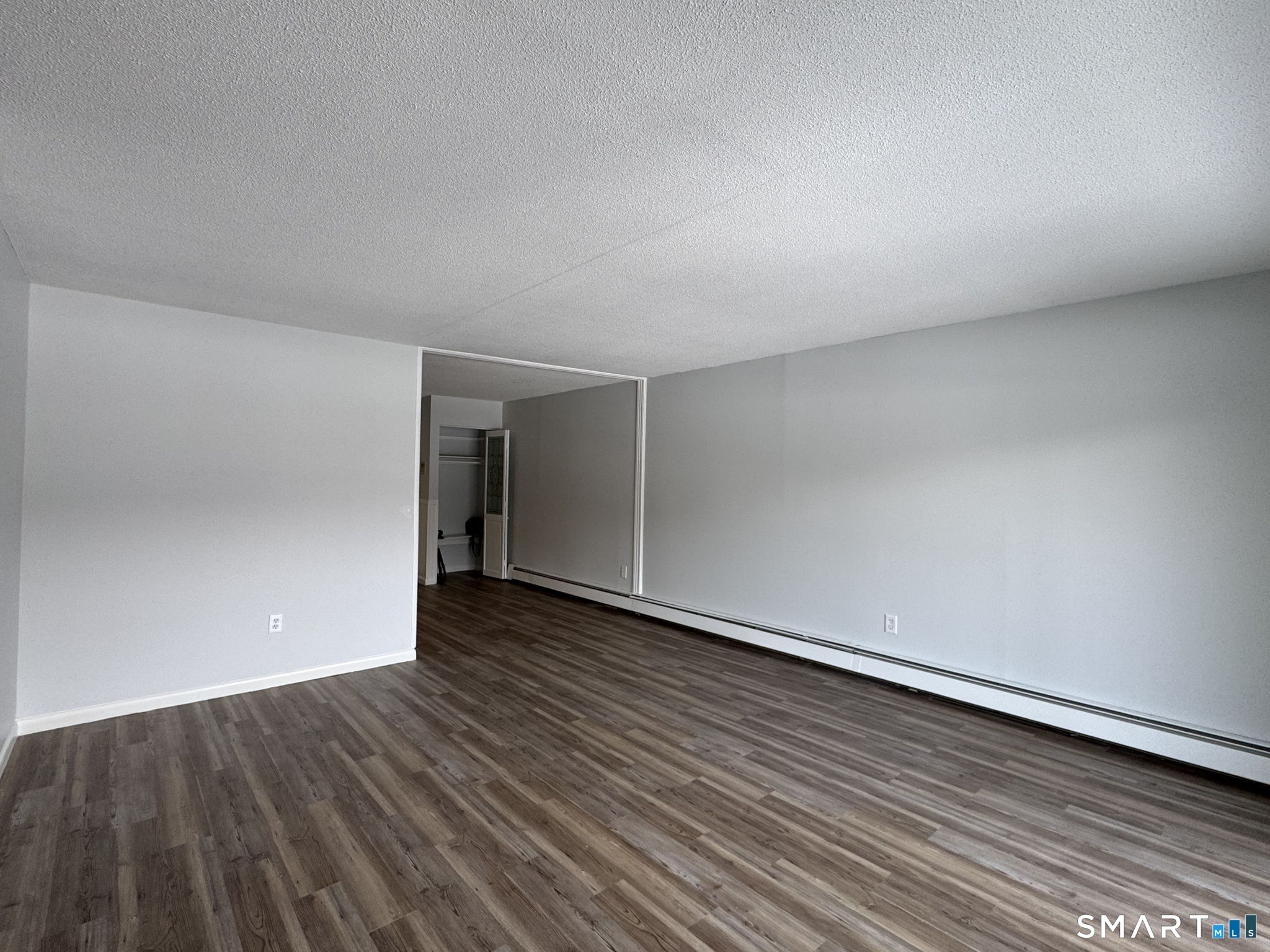75 Balance Rock Road, Unit 20 Seymour, CT 06483 - Photo 29 of 80 a view of an empty room and wooden floor