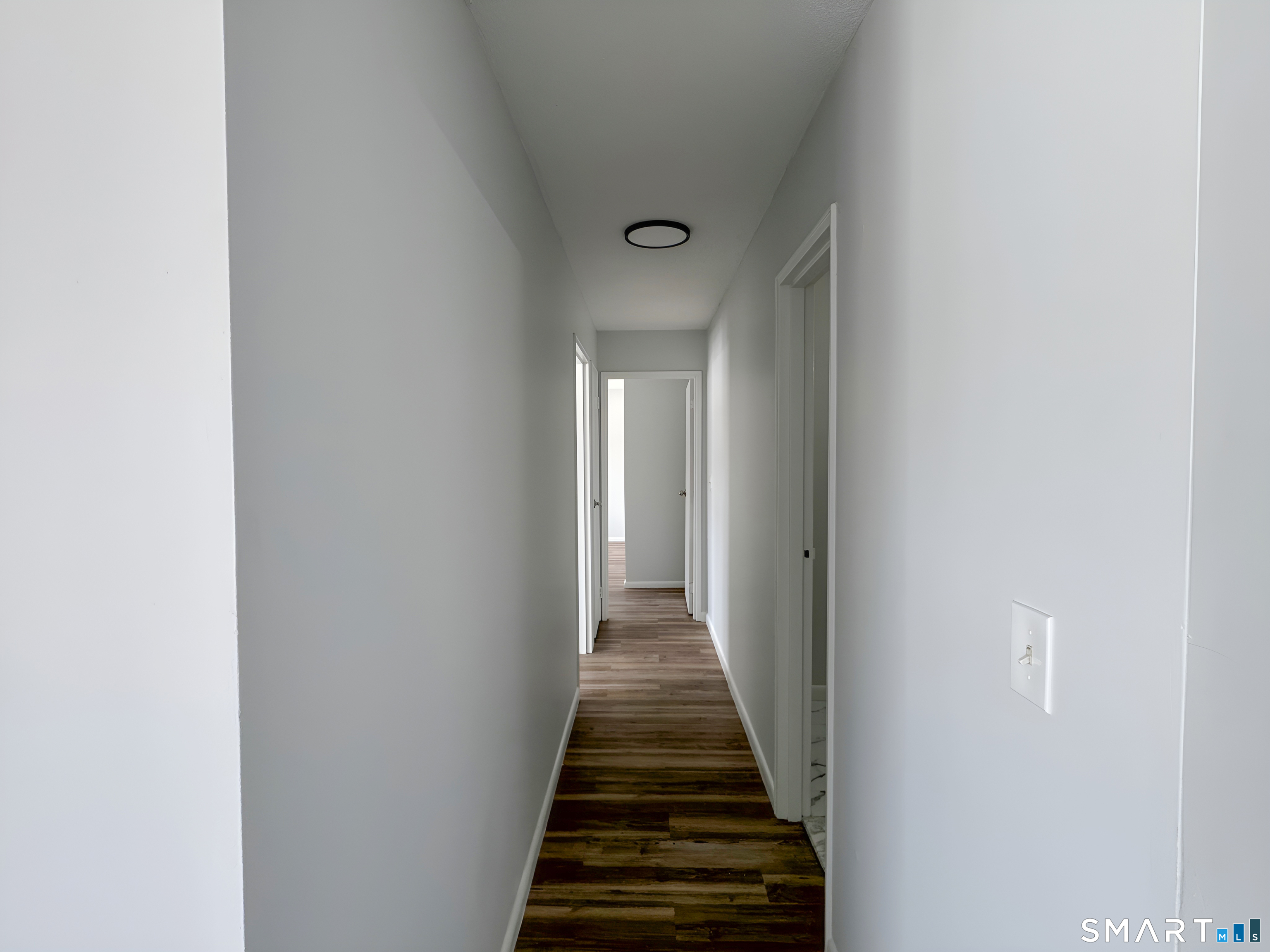 75 Balance Rock Road, Unit 20 Seymour, CT 06483 - Photo 32 of 80 a view of a hallway with wooden floor