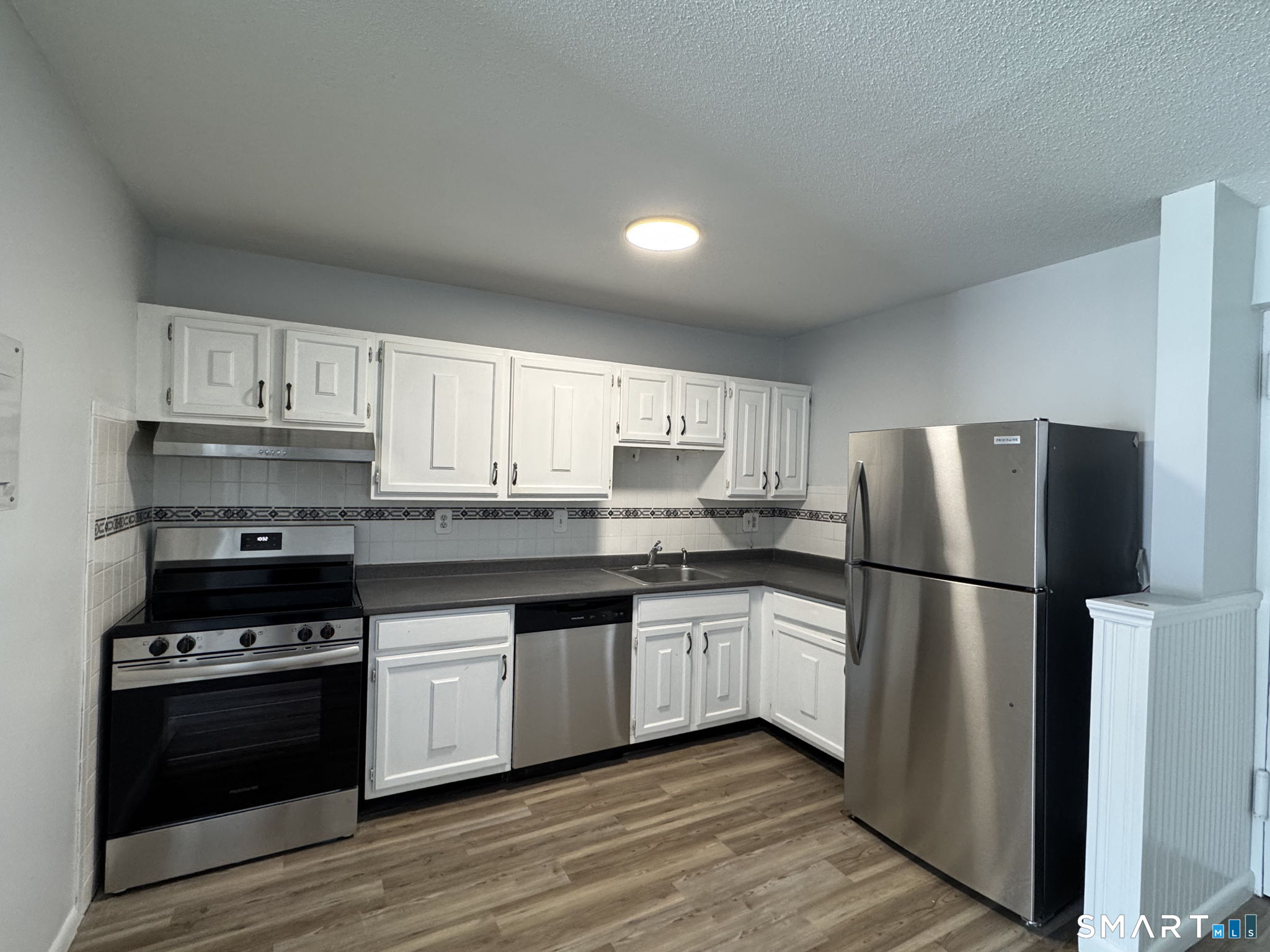 75 Balance Rock Road, Unit 20 Seymour, CT 06483 - Photo 40 of 80 a kitchen with stainless steel appliances granite countertop a stove a refrigerator and a sink