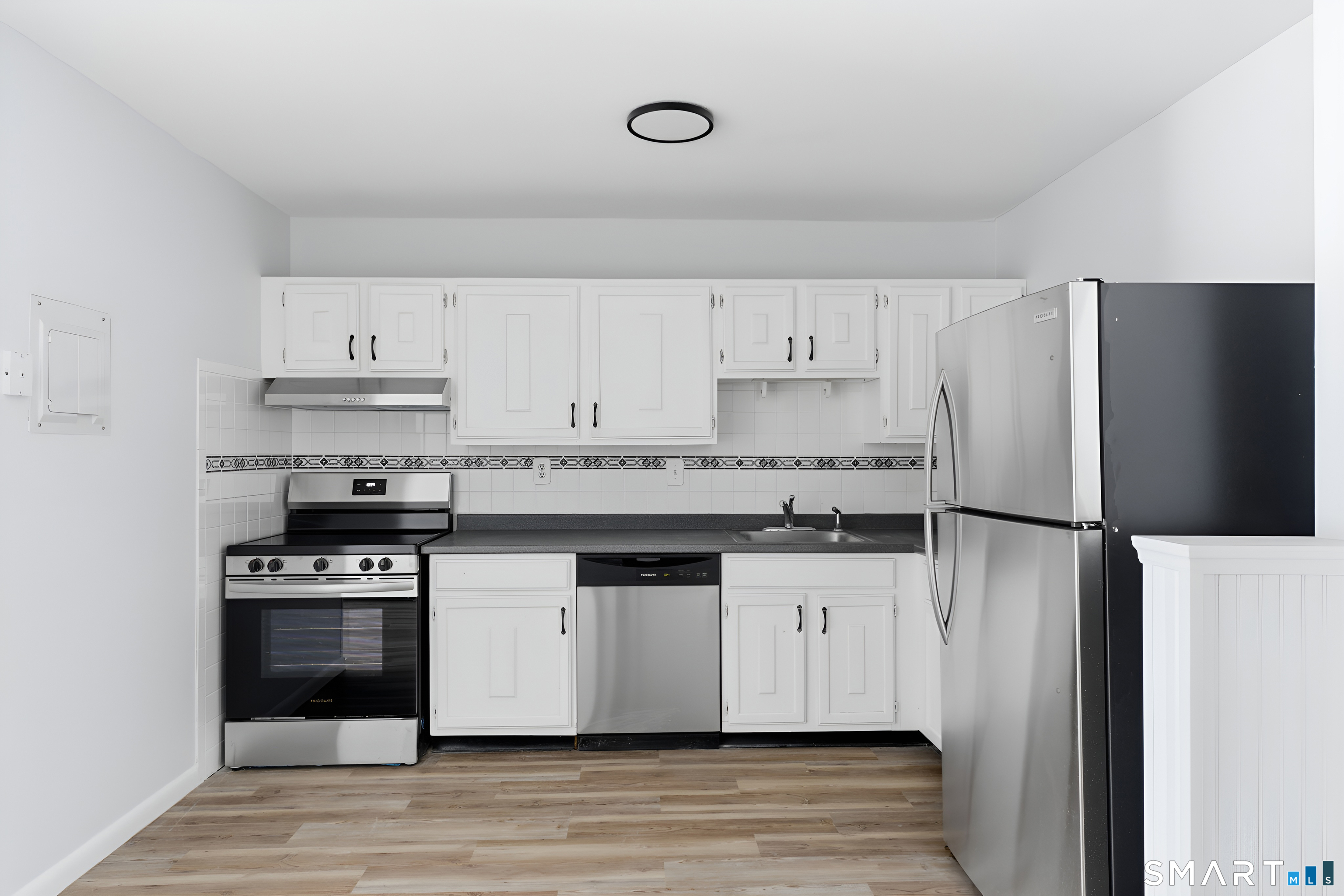 75 Balance Rock Road, Unit 20 Seymour, CT 06483 - Photo 41 of 80 a kitchen with granite countertop a refrigerator and a stove top oven