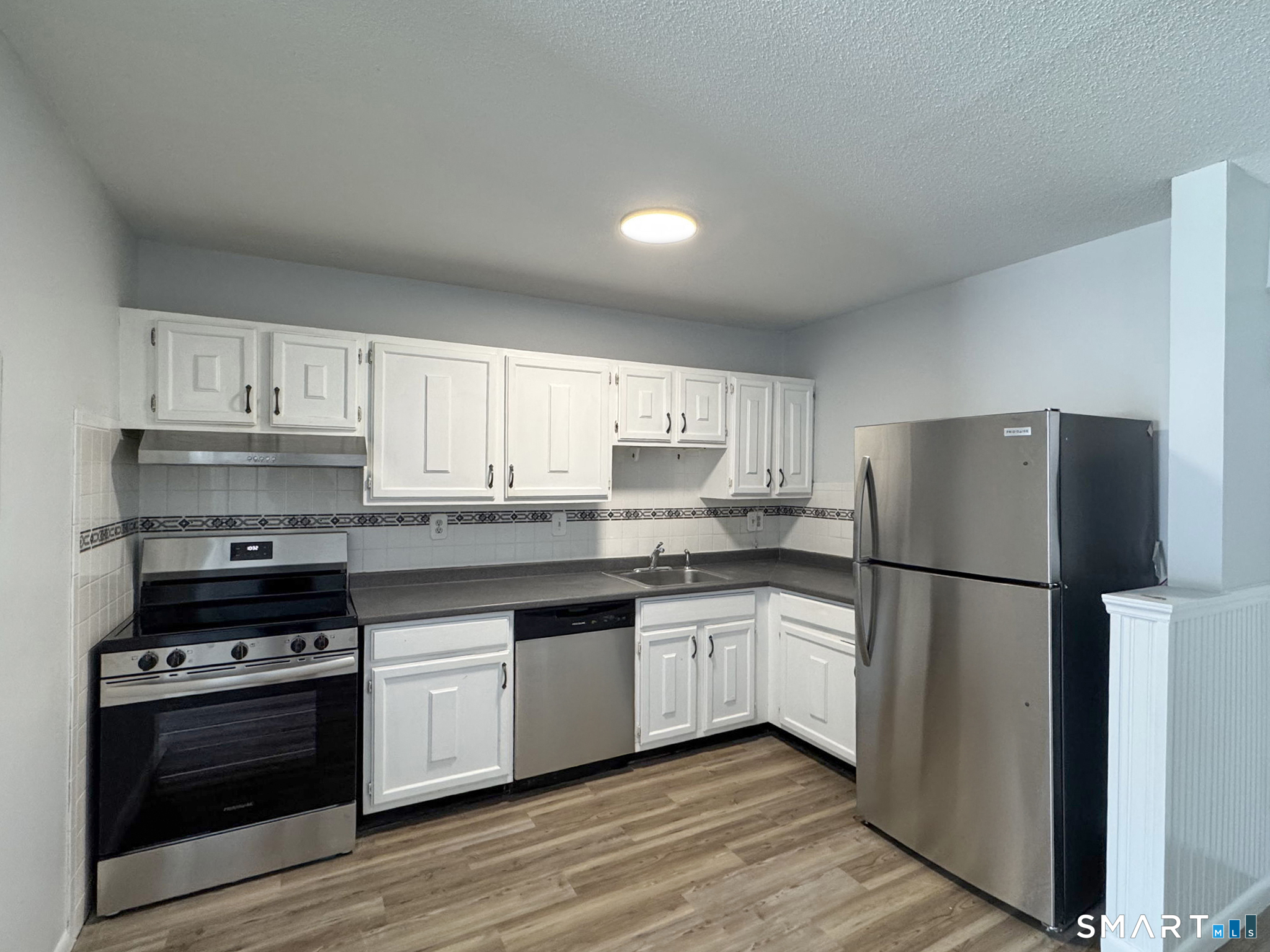 75 Balance Rock Road, Unit 20 Seymour, CT 06483 - Photo 43 of 80 a kitchen with stainless steel appliances a refrigerator sink and cabinets