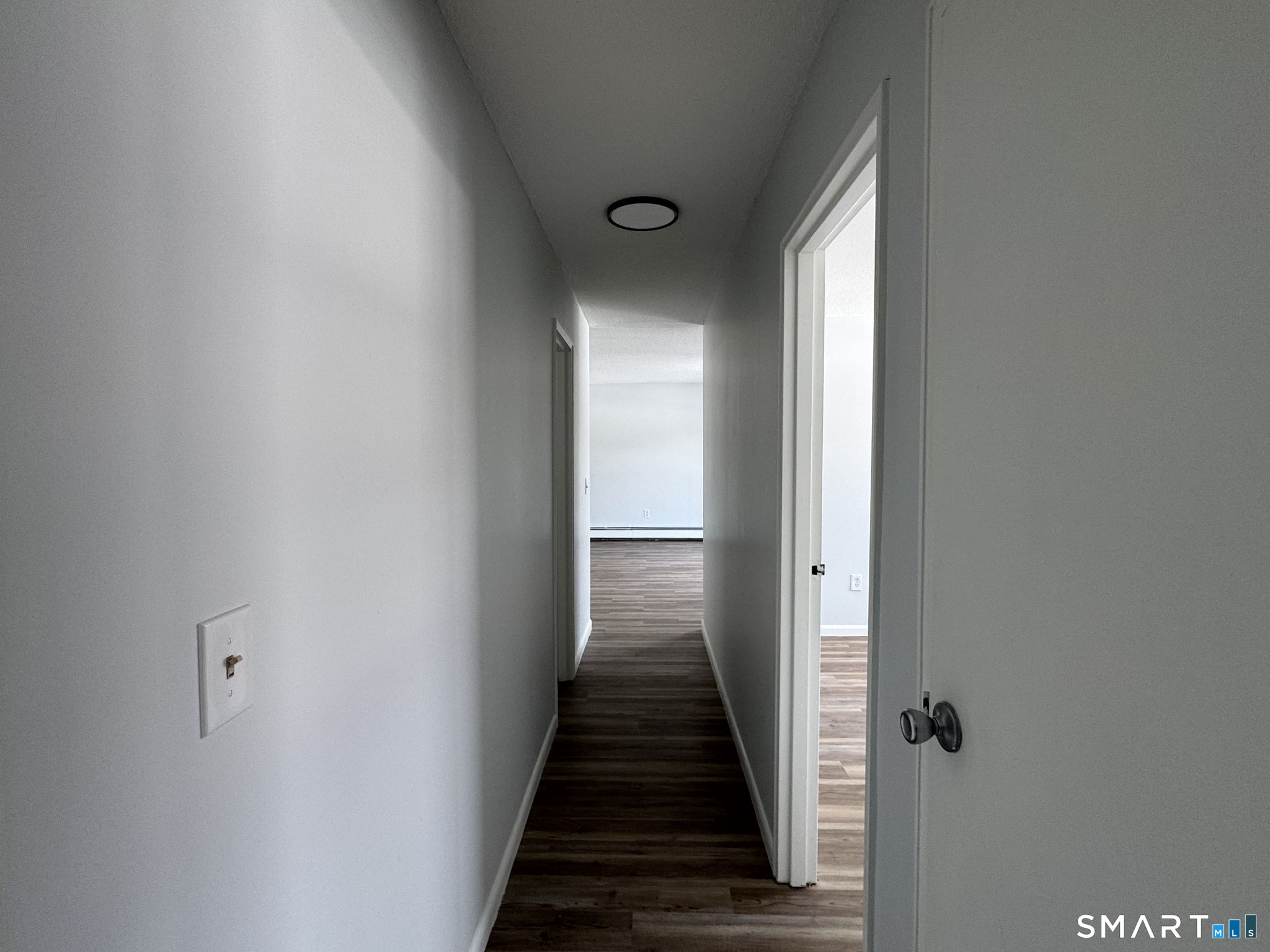 75 Balance Rock Road, Unit 20 Seymour, CT 06483 - Photo 47 of 80 a view of a hallway with wooden floor and staircase