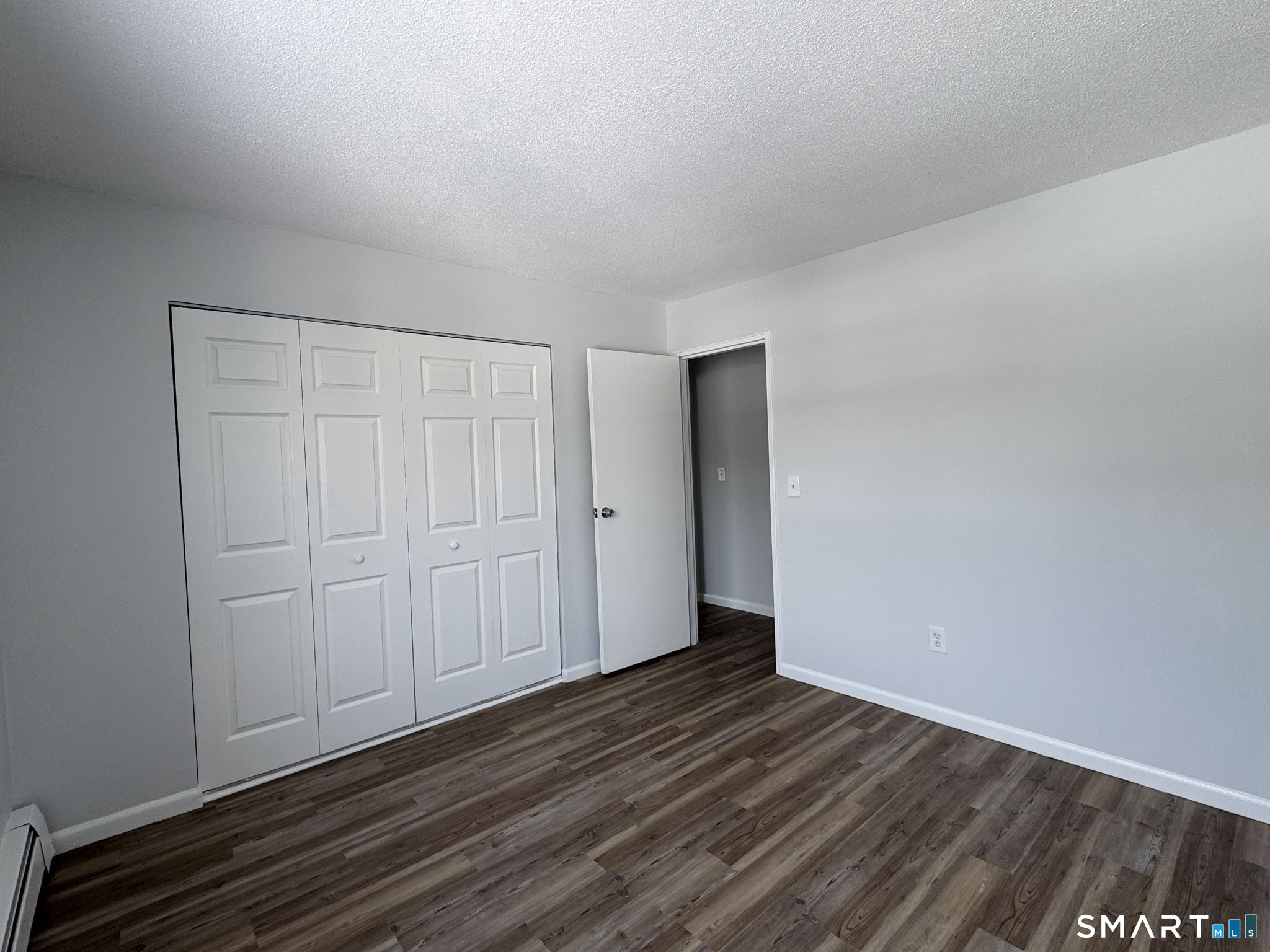 75 Balance Rock Road, Unit 20 Seymour, CT 06483 - Photo 51 of 80 a view of an empty room with wooden floor