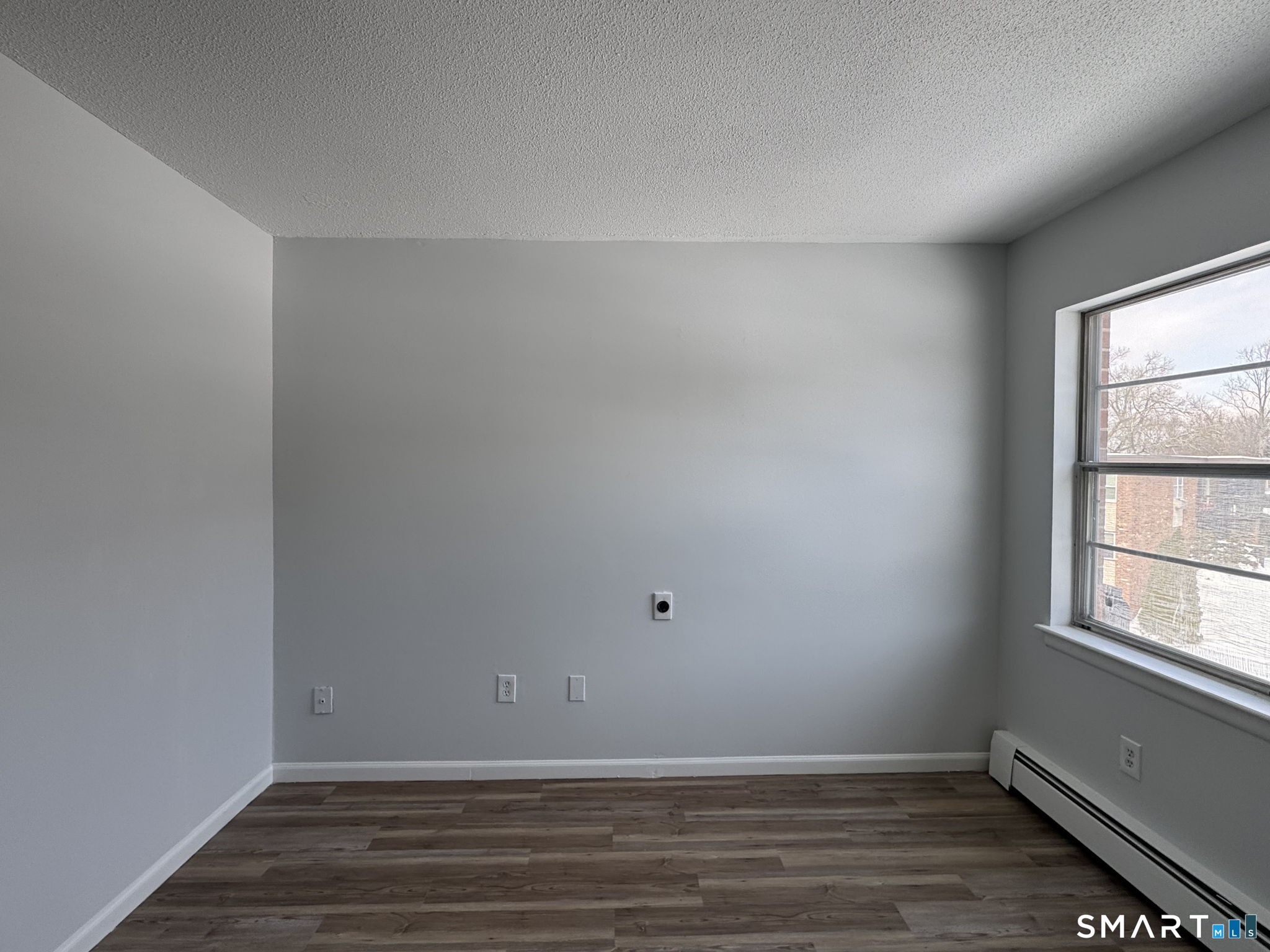 75 Balance Rock Road, Unit 20 Seymour, CT 06483 - Photo 55 of 80 a view of an empty room with wooden floor and a window