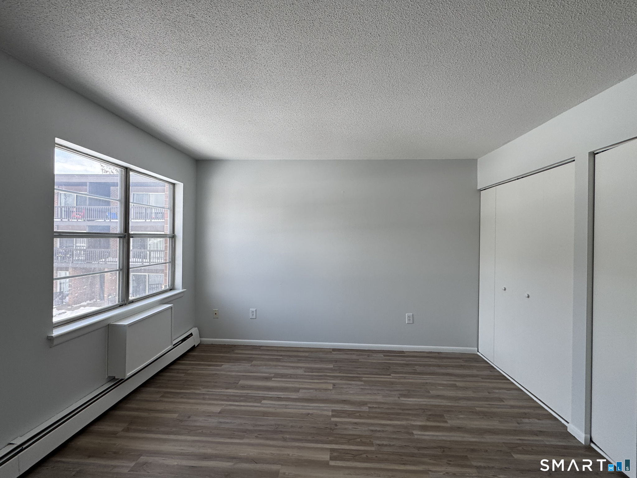 75 Balance Rock Road, Unit 20 Seymour, CT 06483 - Photo 59 of 80 wooden floor in an empty room with a window