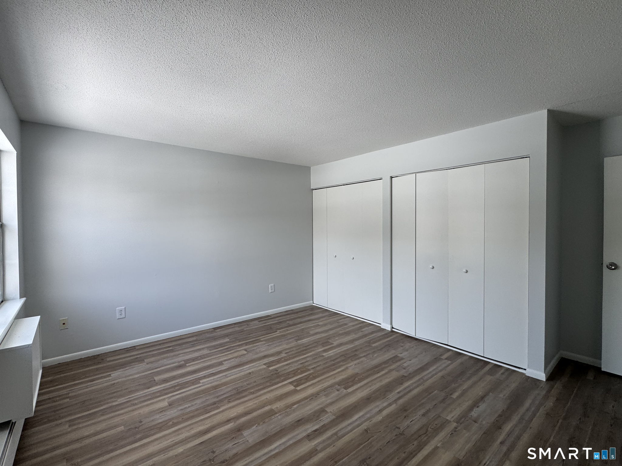75 Balance Rock Road, Unit 20 Seymour, CT 06483 - Photo 61 of 80 a view of an empty room with wooden floor