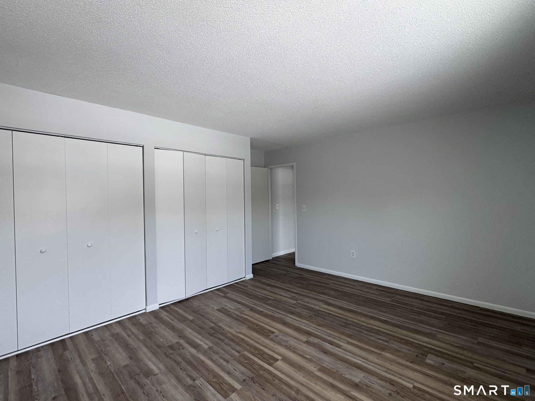 75 Balance Rock Road, Unit 20 Seymour, CT 06483 - Photo 63 of 80 a view of an empty room with wooden floor