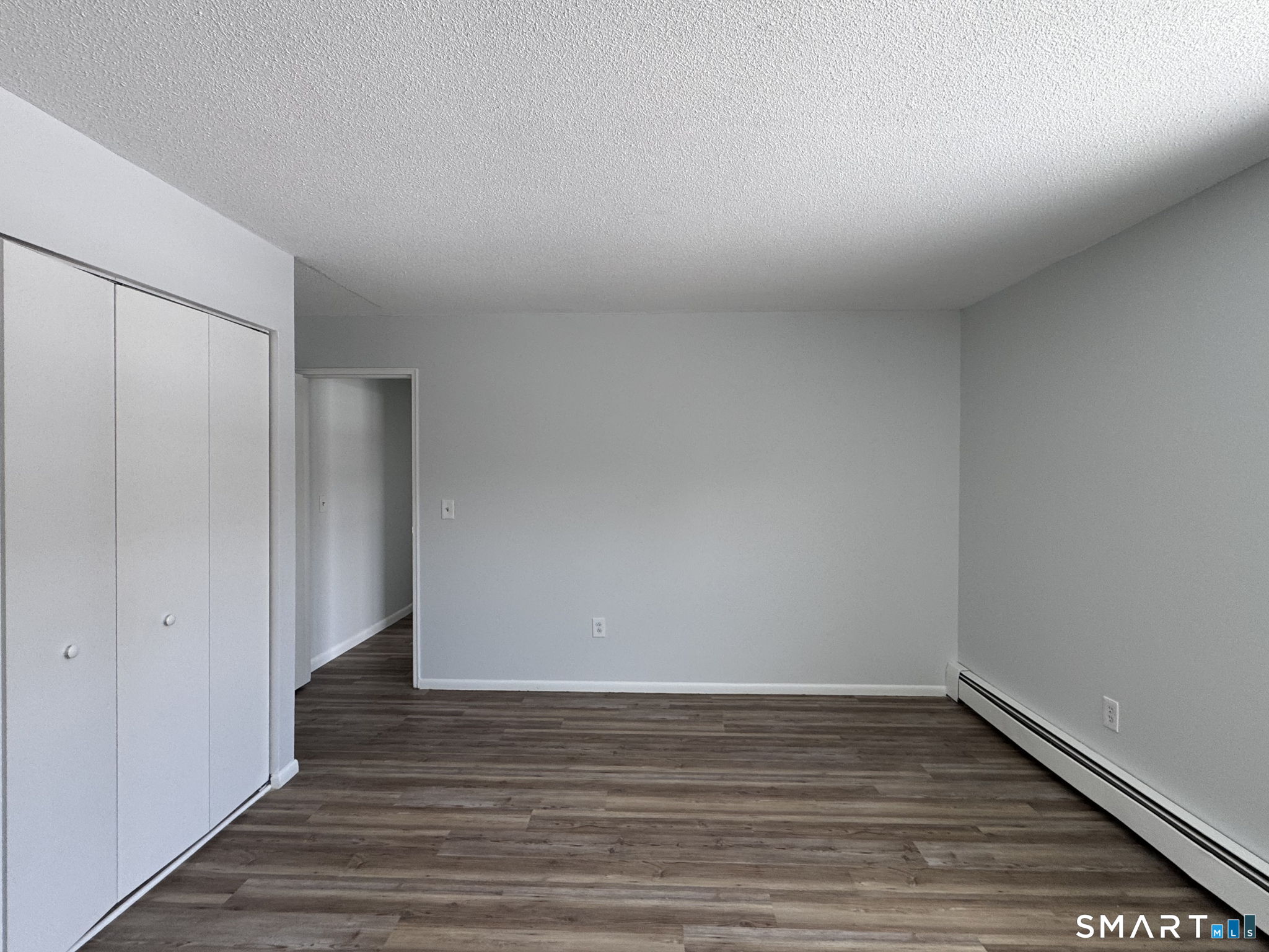 75 Balance Rock Road, Unit 20 Seymour, CT 06483 - Photo 65 of 80 a view of an empty room with wooden floor