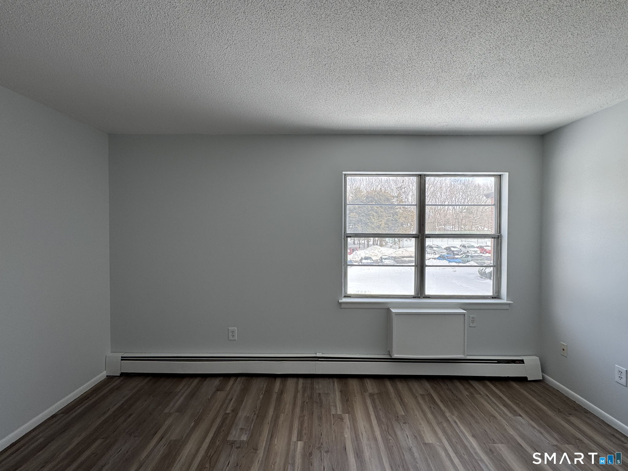 75 Balance Rock Road, Unit 20 Seymour, CT 06483 - Photo 68 of 80 an empty room with wooden floor and windows