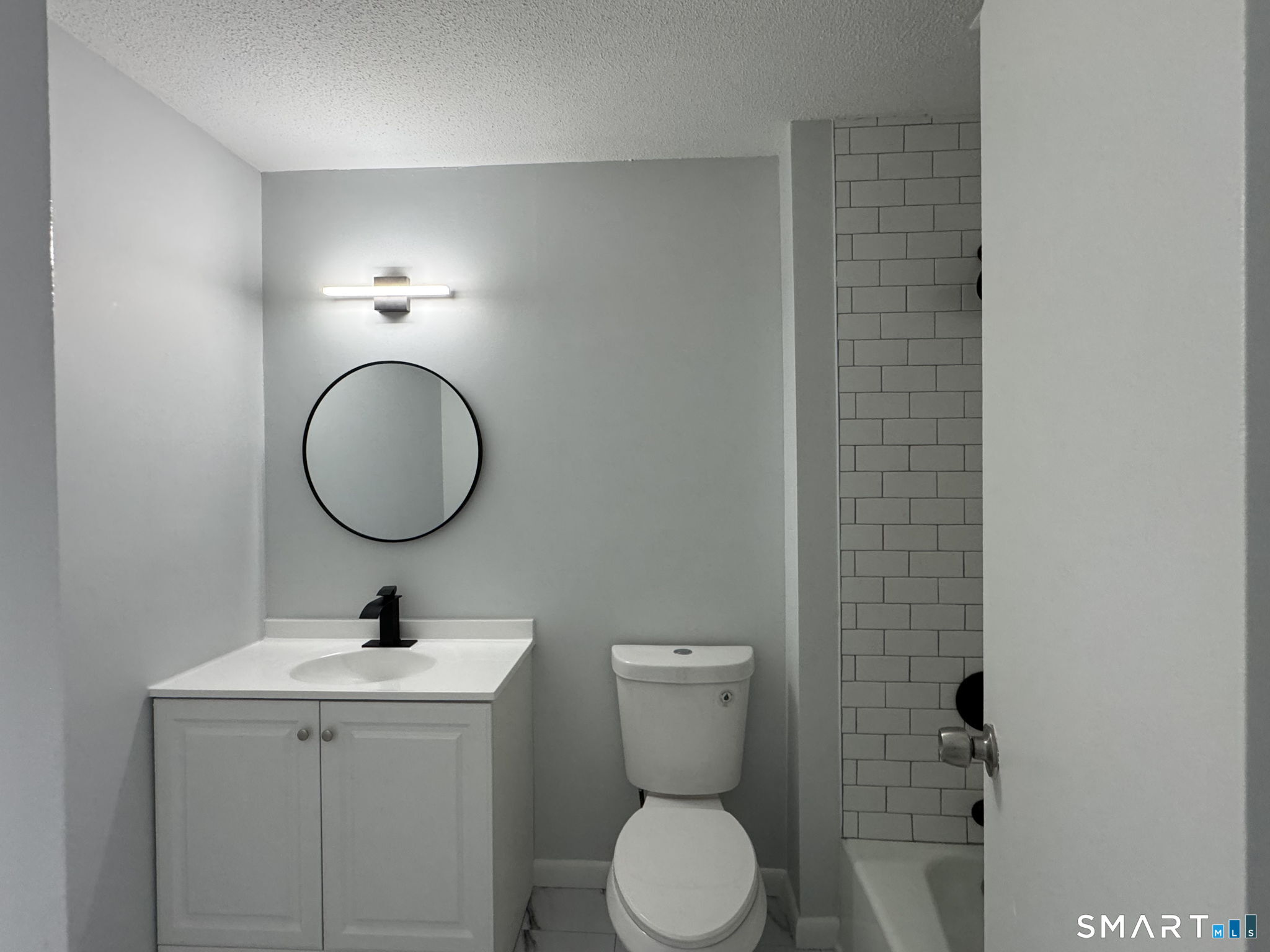 75 Balance Rock Road, Unit 20 Seymour, CT 06483 - Photo 71 of 80 a bathroom with a toilet a sink and mirror