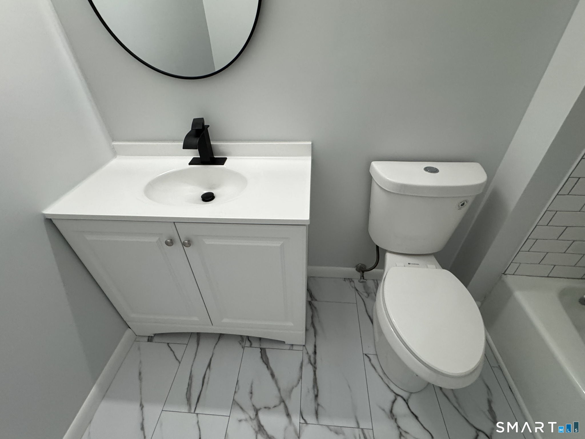 75 Balance Rock Road, Unit 20 Seymour, CT 06483 - Photo 73 of 80 a bathroom with a toilet sink and mirror