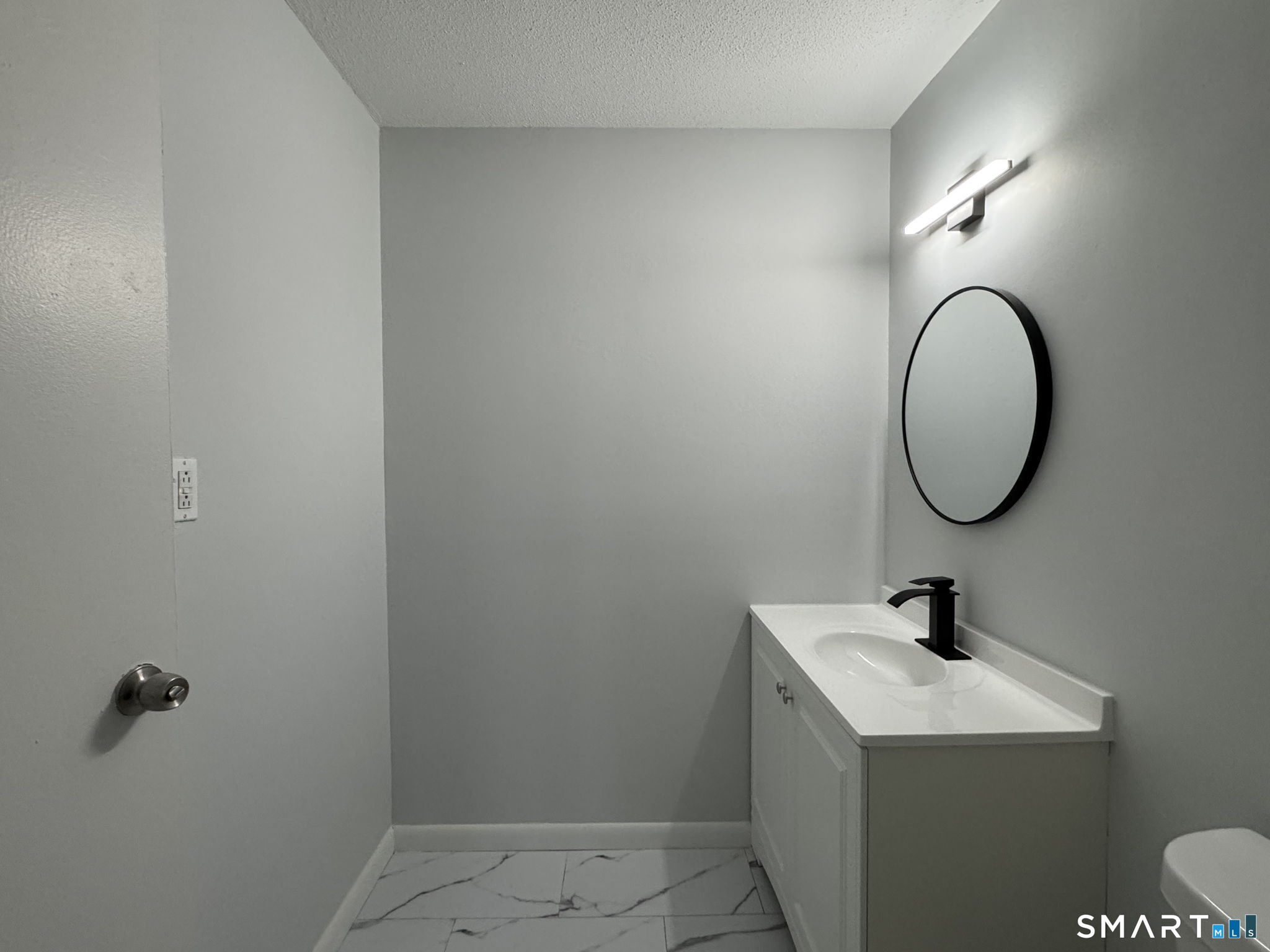 75 Balance Rock Road, Unit 20 Seymour, CT 06483 - Photo 79 of 80 a bathroom with a sink and a mirror