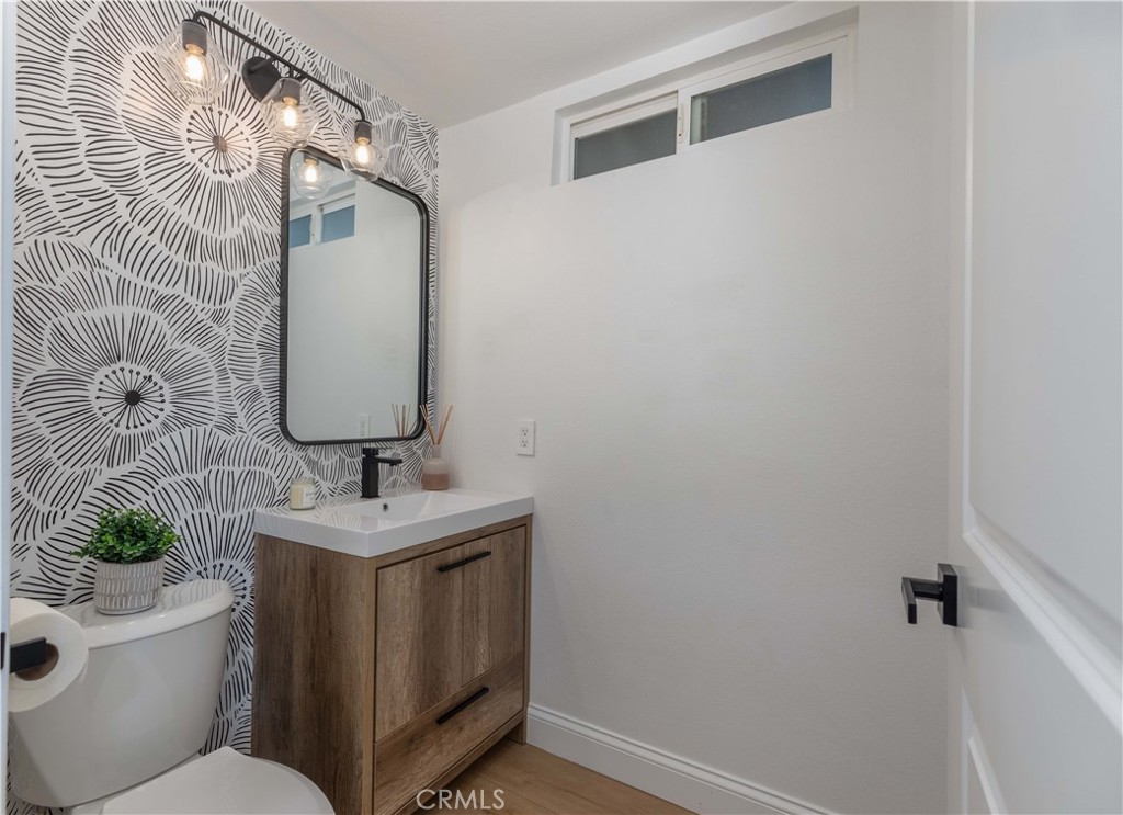 1117 Dennis Drive Costa Mesa, CA 92626 - Photo 12 of 44 a bathroom with a sink toilet and mirror