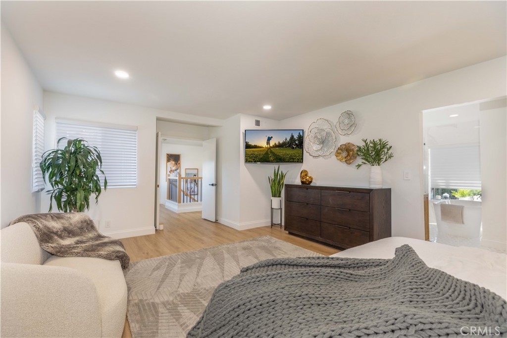 1117 Dennis Drive Costa Mesa, CA 92626 - Photo 20 of 44 a bedroom with a bed and a couch