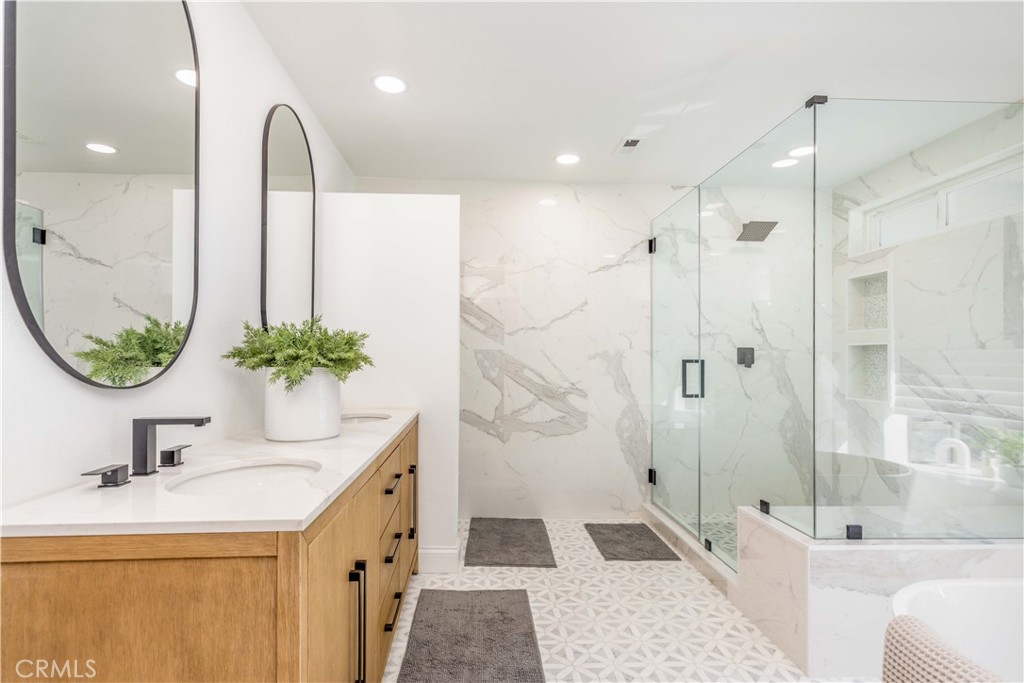1117 Dennis Drive Costa Mesa, CA 92626 - Photo 21 of 44 a bathroom with a sink and a mirror