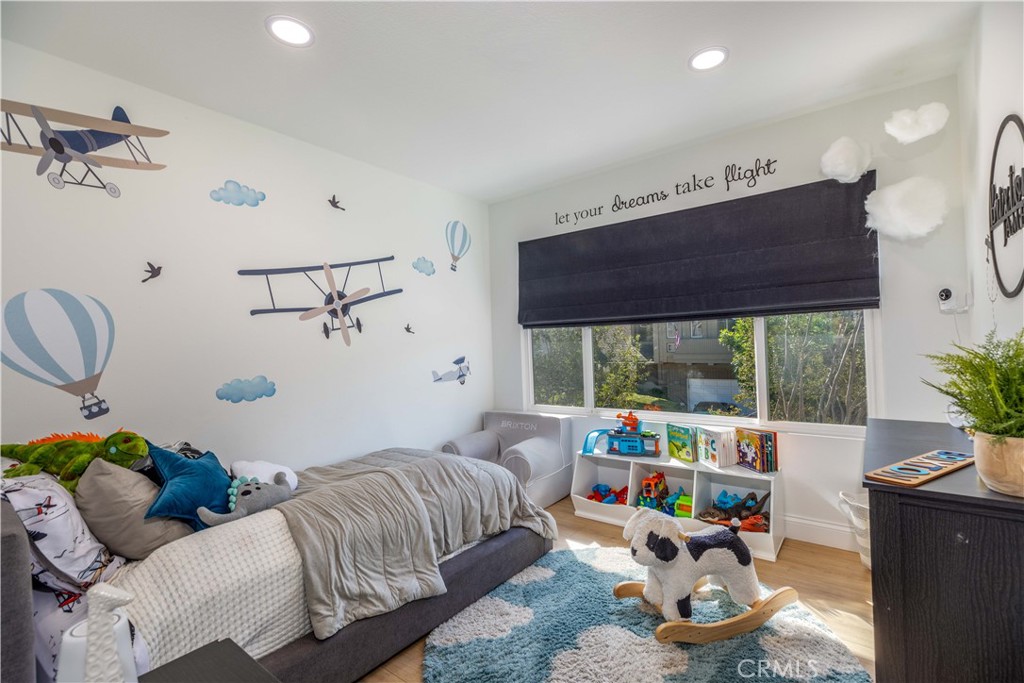 1117 Dennis Drive Costa Mesa, CA 92626 - Photo 30 of 44 a bedroom with furniture and a window