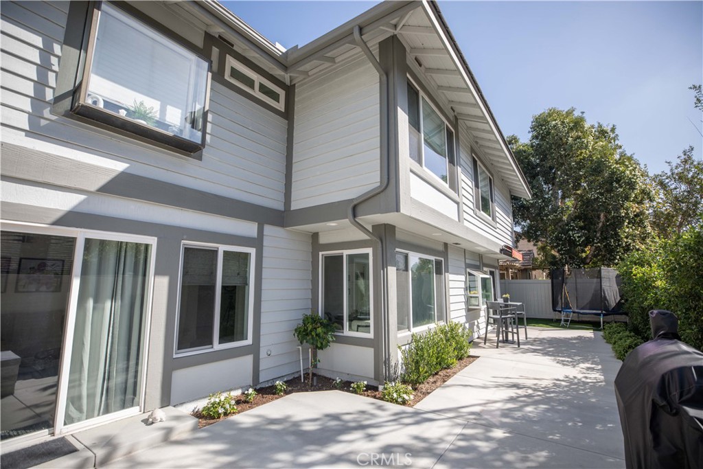 1117 Dennis Drive Costa Mesa, CA 92626 - Photo 33 of 44 a front view of a house with garden and seating space