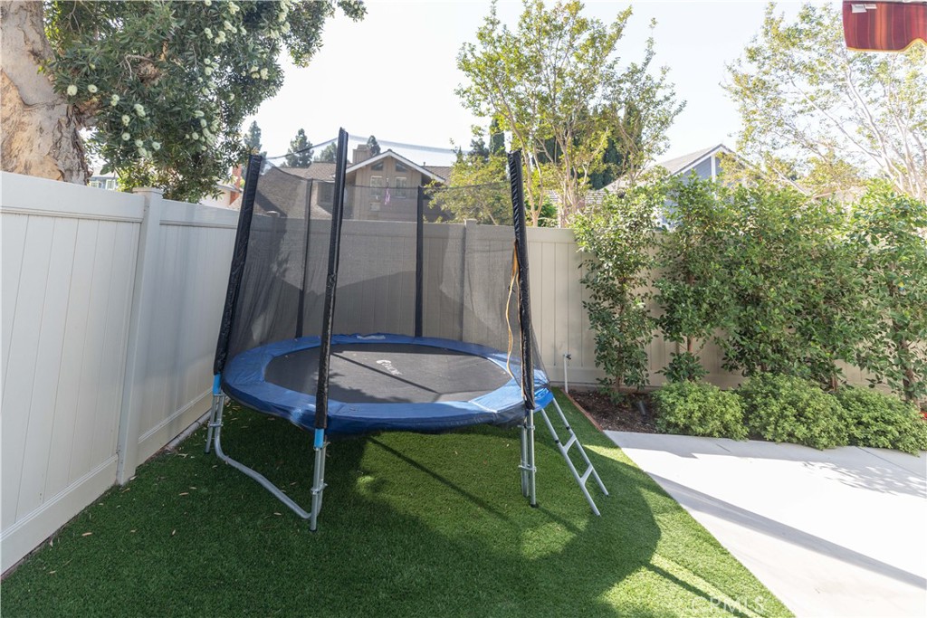 1117 Dennis Drive Costa Mesa, CA 92626 - Photo 38 of 44 a backyard of a house with table and chairs