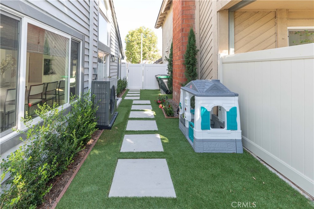1117 Dennis Drive Costa Mesa, CA 92626 - Photo 40 of 44 a front view of a house with a yard